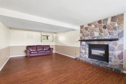 160 Marbrooke Circle Ne, Calgary, AB - Indoor Photo Showing Living Room With Fireplace