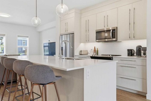 154 Merganser Drive West, Chestermere, AB - Indoor Photo Showing Kitchen With Upgraded Kitchen