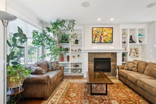 4008 Garrison Boulevard Sw, Calgary, AB - Indoor Photo Showing Living Room With Fireplace