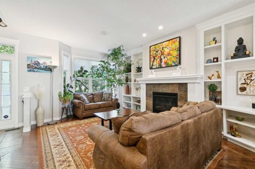4008 Garrison Boulevard Sw, Calgary, AB - Indoor Photo Showing Living Room With Fireplace