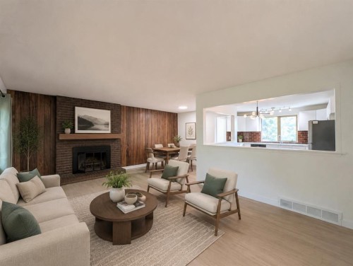 311 72 Avenue Ne, Calgary, AB - Indoor Photo Showing Living Room With Fireplace