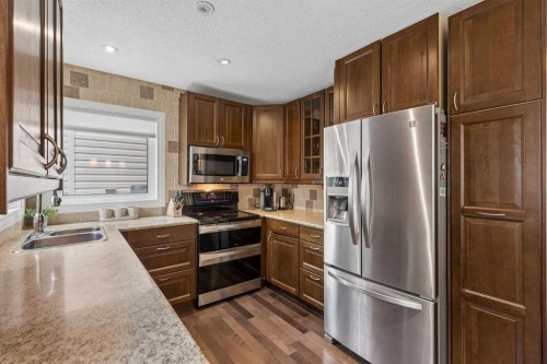 244 Scurfield Place Nw, Calgary, AB - Indoor Photo Showing Kitchen With Double Sink