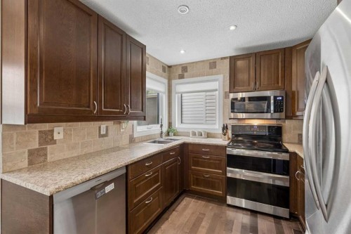 244 Scurfield Place Nw, Calgary, AB - Indoor Photo Showing Kitchen With Double Sink