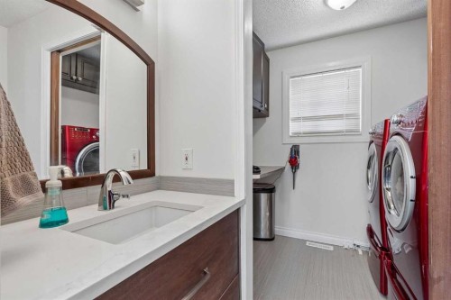 244 Scurfield Place Nw, Calgary, AB - Indoor Photo Showing Laundry Room