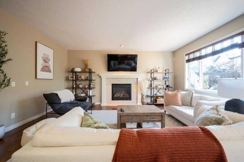 21 Chaparral Valley Court Se, Calgary, AB - Indoor Photo Showing Living Room With Fireplace