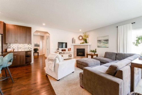 47 Panatella Bay Nw, Calgary, AB - Indoor Photo Showing Living Room With Fireplace