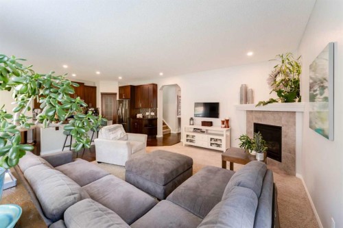 47 Panatella Bay Nw, Calgary, AB - Indoor Photo Showing Living Room With Fireplace