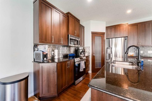 47 Panatella Bay Nw, Calgary, AB - Indoor Photo Showing Kitchen With Double Sink With Upgraded Kitchen