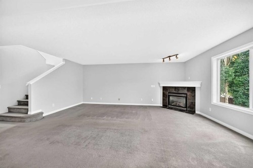 171 Oakmere Green, Chestermere, AB - Indoor With Fireplace