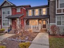 93 Sunvalley Road, Cochrane, AB  - Outdoor With Deck Patio Veranda With Facade 