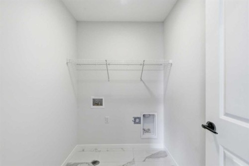 572 Belmont Heath Sw, Calgary, AB - Indoor With Storage
