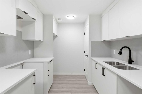 572 Belmont Heath Sw, Calgary, AB - Indoor Photo Showing Kitchen With Double Sink