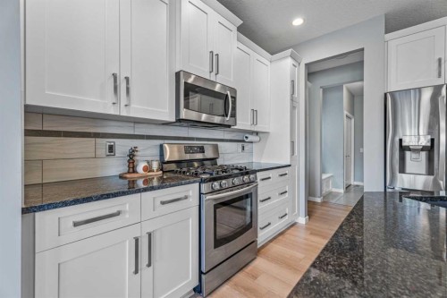 6 Storm Mountain Place, Okotoks, AB - Indoor Photo Showing Kitchen With Upgraded Kitchen