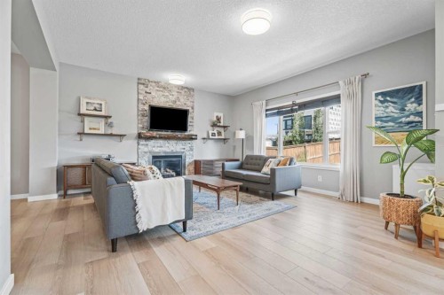 6 Storm Mountain Place, Okotoks, AB - Indoor Photo Showing Living Room With Fireplace