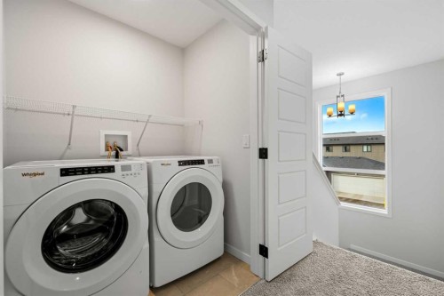 83 Wolf Hollow Rise Se, Calgary, AB - Indoor Photo Showing Laundry Room