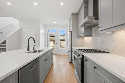83 Wolf Hollow Rise Se, Calgary, AB - Indoor Photo Showing Kitchen With Double Sink With Upgraded Kitchen
