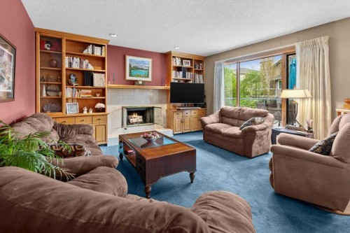 40 Scenic Ridge Place Nw, Calgary, AB - Indoor Photo Showing Living Room With Fireplace