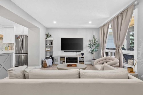 75 Shawglen Way Sw, Calgary, AB - Indoor Photo Showing Other Room With Fireplace