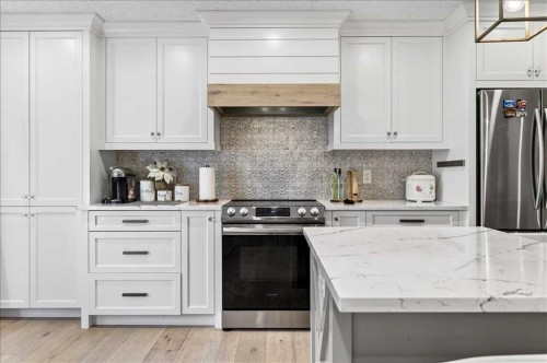 75 Shawglen Way Sw, Calgary, AB - Indoor Photo Showing Kitchen With Stainless Steel Kitchen With Upgraded Kitchen