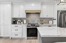 75 Shawglen Way Sw, Calgary, AB  - Indoor Photo Showing Kitchen With Stainless Steel Kitchen With Upgraded Kitchen 