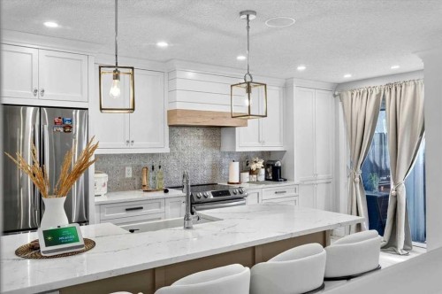 75 Shawglen Way Sw, Calgary, AB - Indoor Photo Showing Kitchen With Stainless Steel Kitchen With Upgraded Kitchen