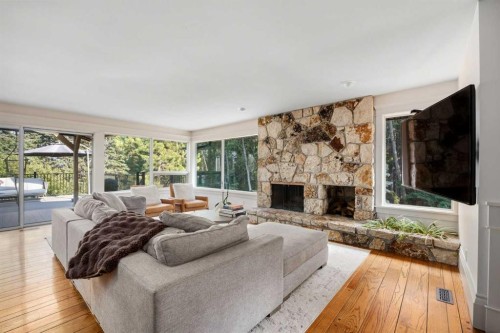 15 Elbow River Point, Rural Rocky View County, AB - Indoor Photo Showing Living Room With Fireplace