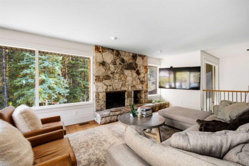 15 Elbow River Point, Rural Rocky View County, AB - Indoor Photo Showing Living Room With Fireplace
