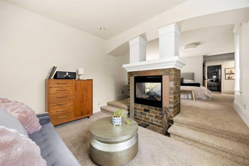 15 Elbow River Point, Rural Rocky View County, AB - Indoor Photo Showing Living Room With Fireplace