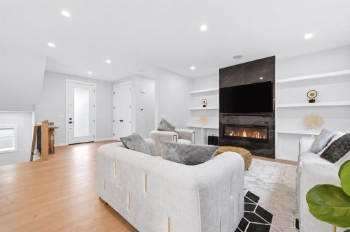 105 Rockhaven Green Nw, Calgary, AB - Indoor Photo Showing Living Room With Fireplace