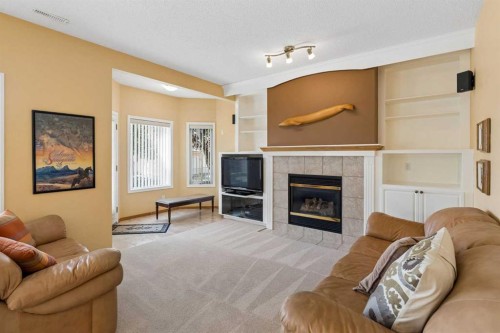 42 Scimitar Circle Nw, Calgary, AB - Indoor Photo Showing Living Room With Fireplace