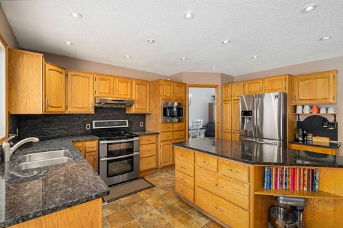 1114 Whitfield Avenue, Crossfield, AB - Indoor Photo Showing Kitchen With Double Sink