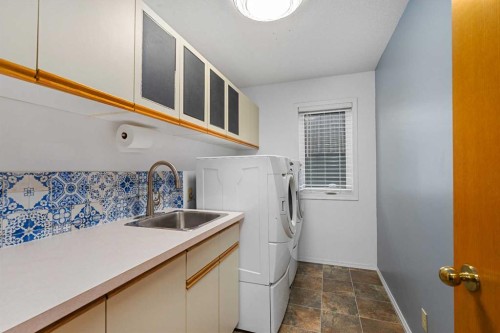 1114 Whitfield Avenue, Crossfield, AB - Indoor Photo Showing Laundry Room