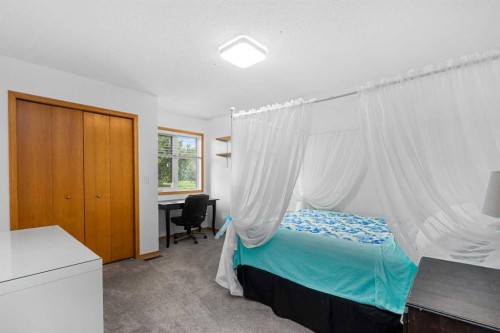 1114 Whitfield Avenue, Crossfield, AB - Indoor Photo Showing Bedroom