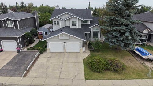 1114 Whitfield Avenue, Crossfield, AB - Outdoor With Facade