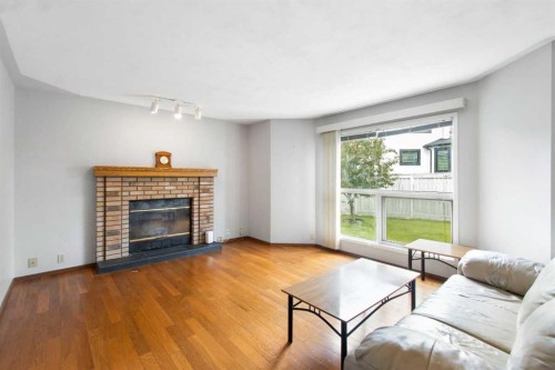 32 Del Rio Place Ne, Calgary, AB - Indoor Photo Showing Living Room With Fireplace