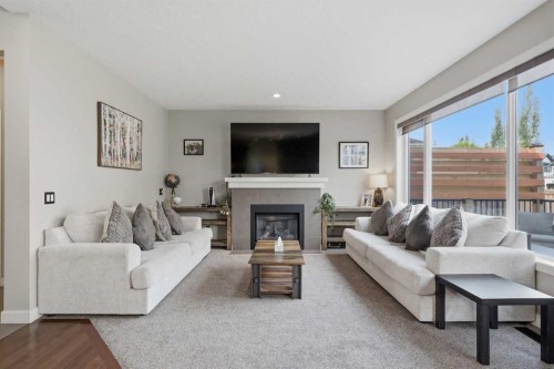 4 Drake Landing Gate, Okotoks, AB - Indoor Photo Showing Living Room With Fireplace