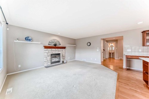 80 Eversyde Way Sw, Calgary, AB - Indoor With Fireplace
