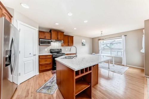 80 Eversyde Way Sw, Calgary, AB - Indoor Photo Showing Kitchen With Double Sink