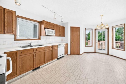 396 Hawkstone Drive Nw, Calgary, AB - Indoor Photo Showing Kitchen With Double Sink