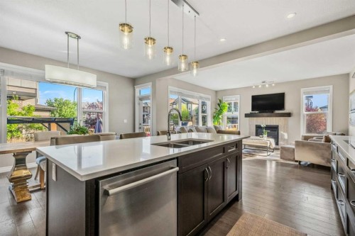 86 Legacy Green Se, Calgary, AB - Indoor Photo Showing Kitchen With Fireplace With Double Sink
