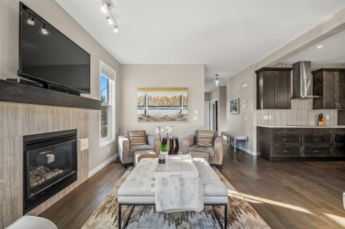 86 Legacy Green Se, Calgary, AB - Indoor Photo Showing Living Room With Fireplace