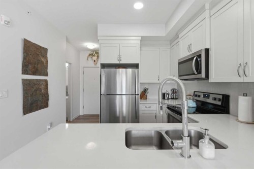 413-20 Seton Park Se, Calgary, AB - Indoor Photo Showing Kitchen With Double Sink With Upgraded Kitchen