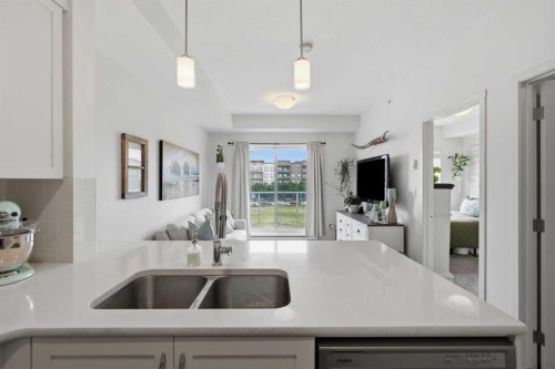 413-20 Seton Park Se, Calgary, AB - Indoor Photo Showing Kitchen With Double Sink