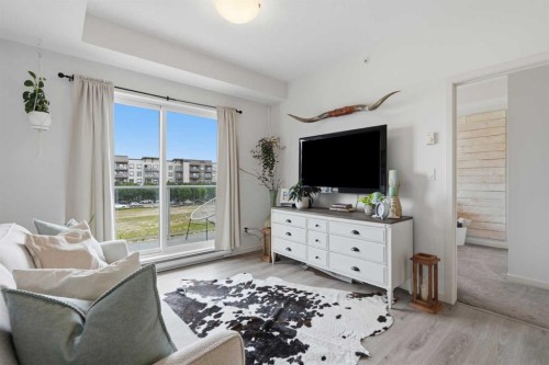 413-20 Seton Park Se, Calgary, AB - Indoor Photo Showing Living Room