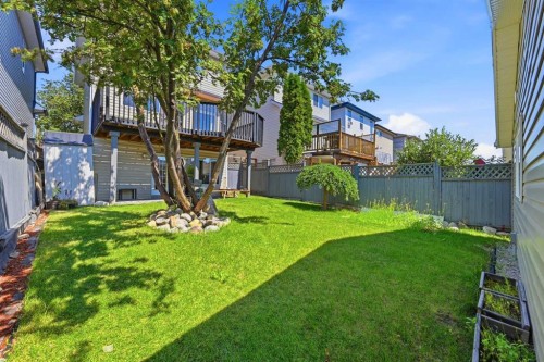 119 Bridlewood Common Sw, Calgary, AB - Outdoor With Backyard