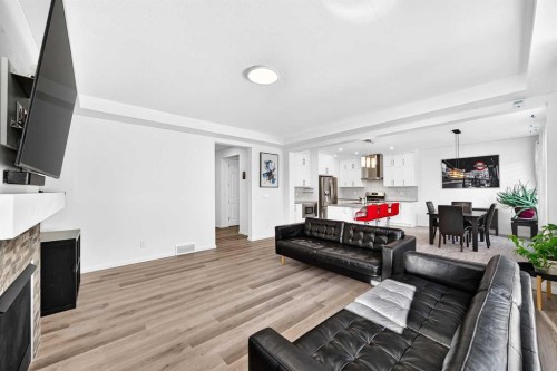 188 Carrington Crescent Nw, Calgary, AB - Indoor Photo Showing Living Room With Fireplace