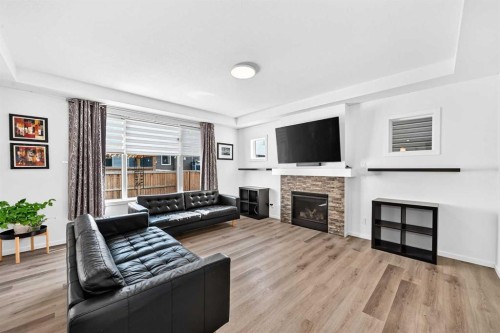 188 Carrington Crescent Nw, Calgary, AB - Indoor Photo Showing Living Room With Fireplace