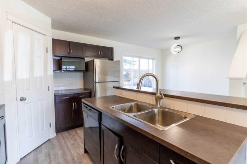 157 Country Village Manor Ne, Calgary, AB - Indoor Photo Showing Kitchen With Double Sink