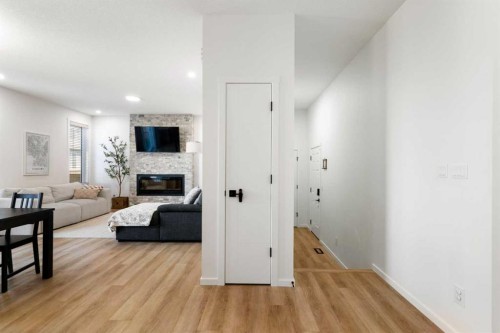 18 Southwinds Link Sw, Airdrie, AB - Indoor With Fireplace