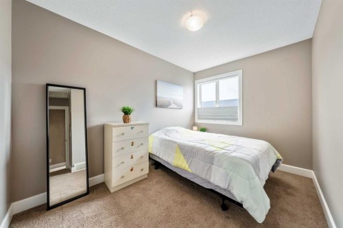 1333 Windstone Road Sw, Airdrie, AB - Indoor Photo Showing Bedroom